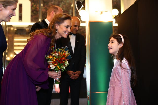 The Princess of Wales meets Evie Peters, seven, at the royal film performance and world premiere of Digger, at the Odeon Luxe in Leicester Square 