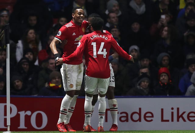 Anthony Martial (left) celebrates scoring against Watford