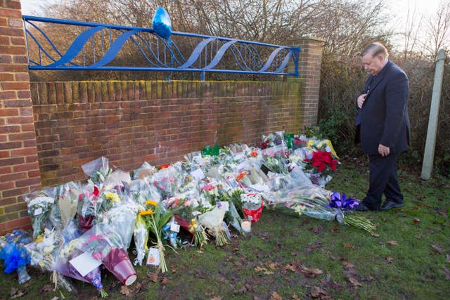 Floral bouquets left at the entrance to Debden Park High School in Willingale Road, Loughton, Essex