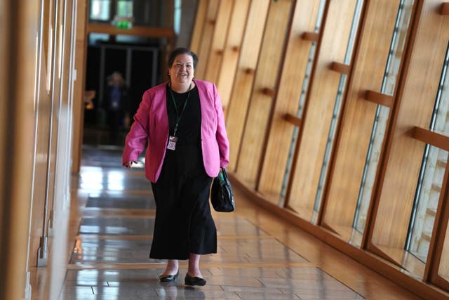 Dame Jackie Baillie walking through a corridor at Holyrood