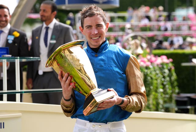James Doyle with the trophy following Lazzat's victory