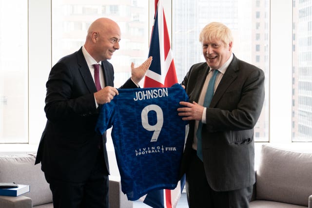 Gianni Infantino, left, pictured with British Prime Minister Boris Johnson