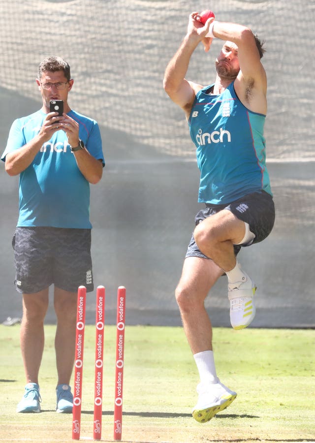 Jon Lewis, left, films James Anderson's bowling action