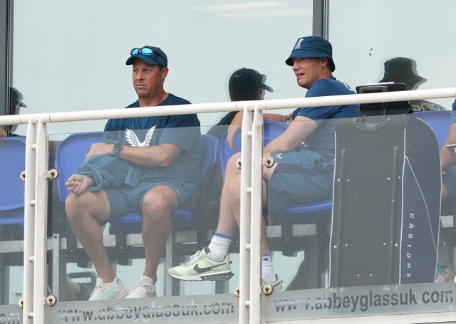 Andrew Flintoff sits next to England batting coach Marcus Trescothick