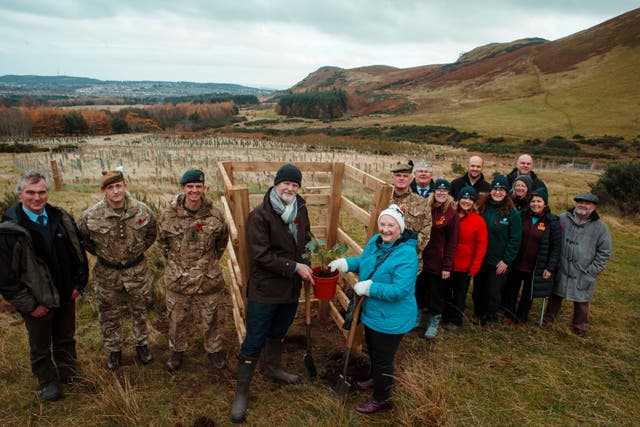 Planting a Verdun oak, descended from an acorn collected on the battlefield in France, at Scotland’s First World War Centenary Wood at Dreghorn in Edinburgh 