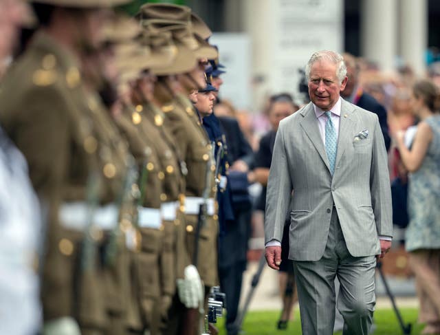 The visit began with the usual formalities - Charles inspected military personnel during the ceremonial welcome at Old Government House in Brisbane (Steve Parsons/PA)