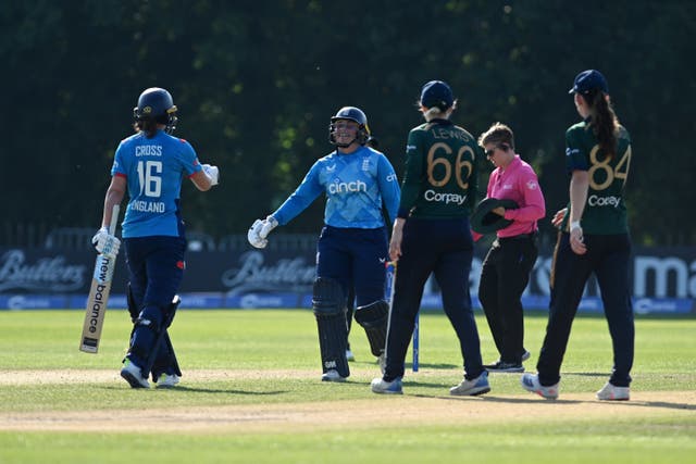 England' captain Kate Cross (right) celebrates with Bess Heath after making the winning run during the first Women’s ODI against Ireland in Belfast