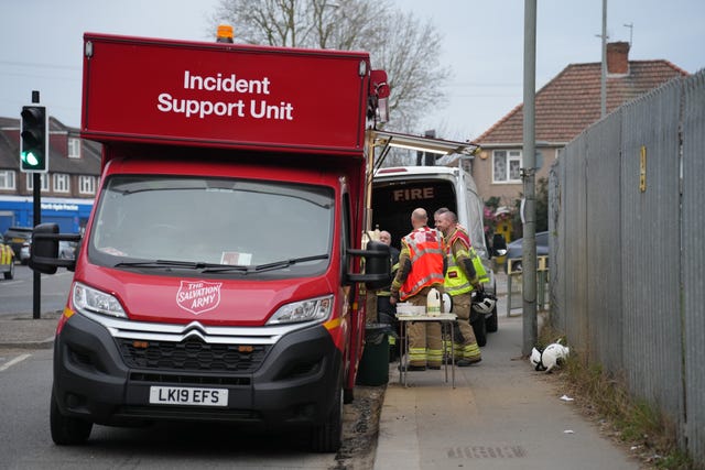 Emergency services at the scene in Roseville Road, west London, near the electrical substation which caught fire