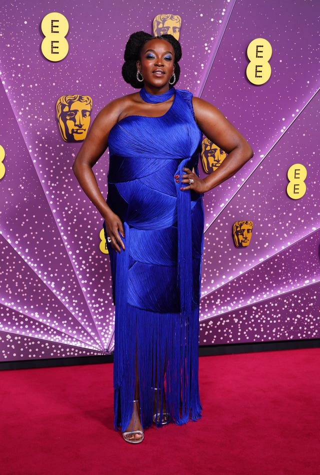 Wunmi Mosaku in a blue gown