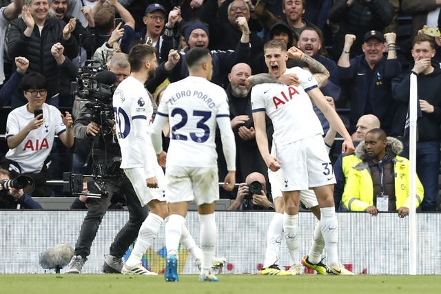 Tottenham’s Micky van de Ven, right, celebrates scoring