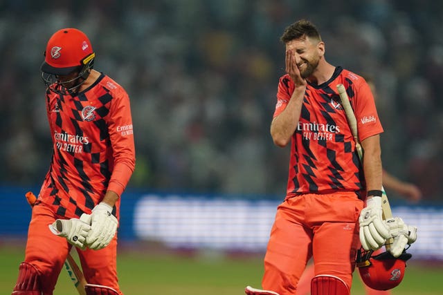 Lancashire Lightning’s Richard Gleeson (right) looking dejected after his side lost the Vitality Blast T20 final match at Edgbaston Stadium, Birmingham