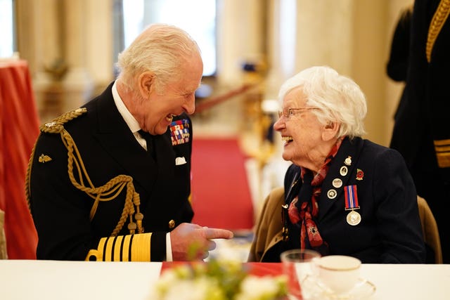 The King joins 101-year-old Second World War veteran Ruth Barnwell at a tea party in Buckingham Palace, central London, following the military procession to mark the 80th anniversary of VE Day