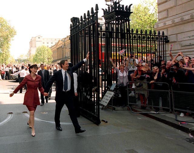 Tony Blair and his wife, Cherie, walk into Downing Street after Labour won the 1997 general election