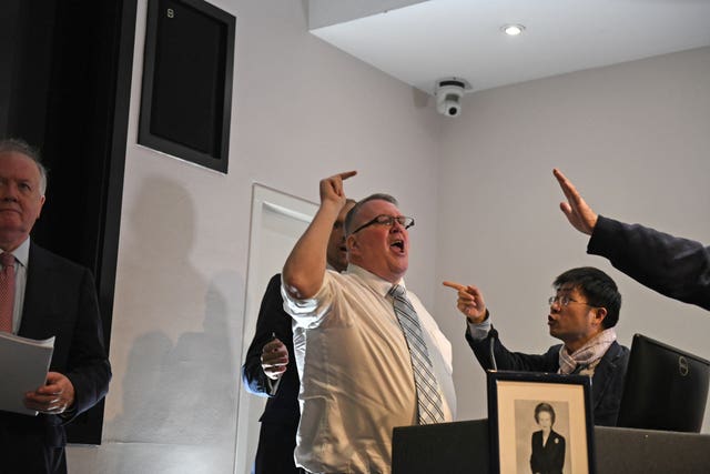 A protester storms onto the stage after Esther McVey’s speech