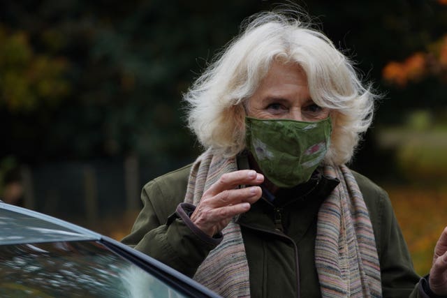 Camilla wore a face mas wen she first arrived at the event. Arthur Edwards/The Sun