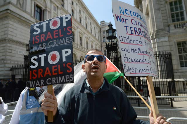 Protesters gathered on Whitehall as Benjamin Netanyahu met Theresa May (Victoria Jones/PA)