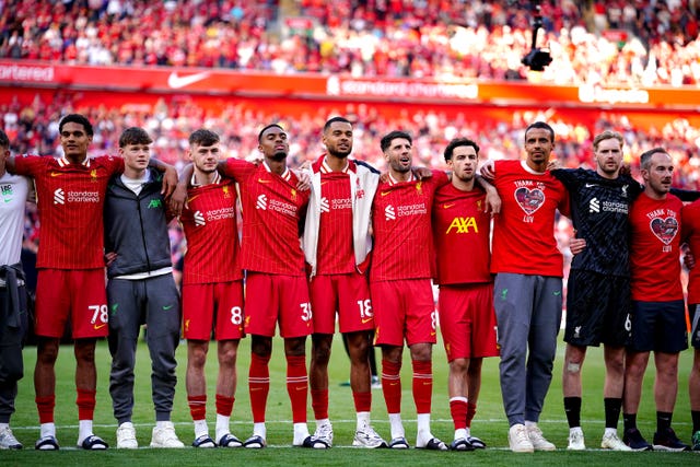 Liverpool players line up on the pitch at the end of the match
