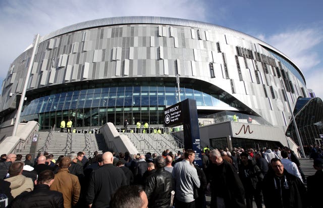 Fans arrive at the Tottenham Hotspur Stadium