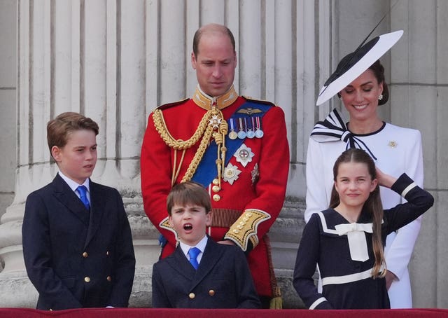 The Prince and Princess and Wales with their children on the balcony at Buckingham Palace
