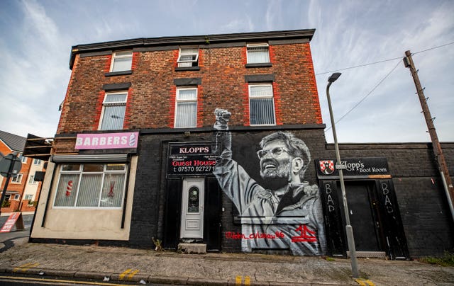 Jurgen Klopp features on the side of a barber shop in Liverpool