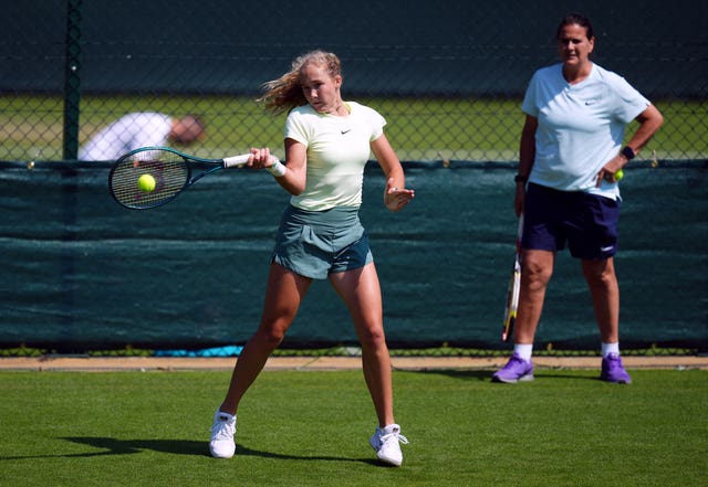 Mirra Andreeva practising with coach Conchita Martinez at Wimbledon in 2024