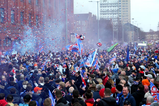 Rangers fans celebrate outside Ibrox
