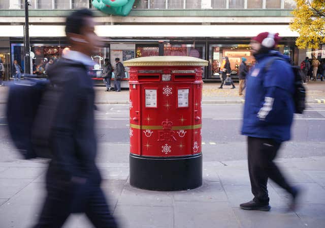 A Royal Mail Christmas postbox is unveiled on Oxford Street