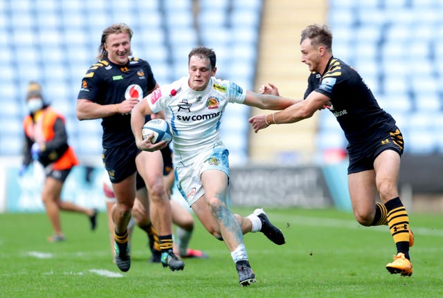 Exeter’s Tom Wyatt is tackled by Wasps’ Josh Bassett at the Ricoh Arena