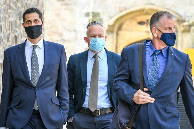 Sergeant Geraint Jones, centre, arrives at Plymouth Magistrates' Court for his trial (Ben Birchall/PA)