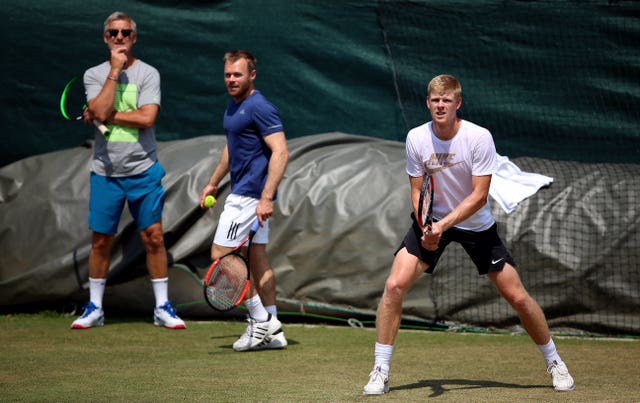 Coaches Fredrik Rosengren (left) and Mark Hilton (centre) watch Edmund practice