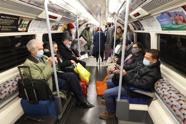 Passengers on Transport for London services will still be required to wear face coverings (James Manning/PA)
