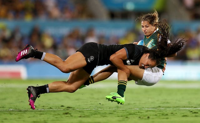 New Zealand's Portia Woodman, left, produces a powerful tackle on South Africa's Chane Stadler during the pool stage of the women's rugby sevens at the 2018 Commonwealth Games in Gold Coast, Australia. New Zealand won the match 41-0 and went on to beat Australia in the final of the tournament