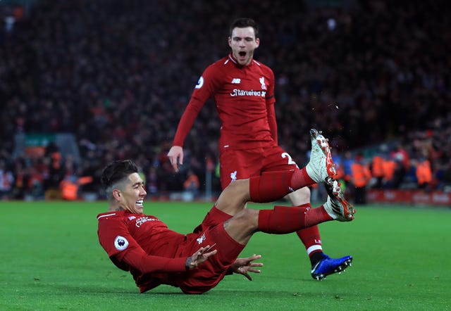 Hat-trick hero Roberto Firmino celebrates with Andy Robertson after scoring against Arsenal