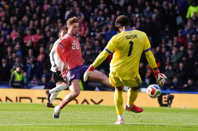 Zion Suzuki clears the ball
