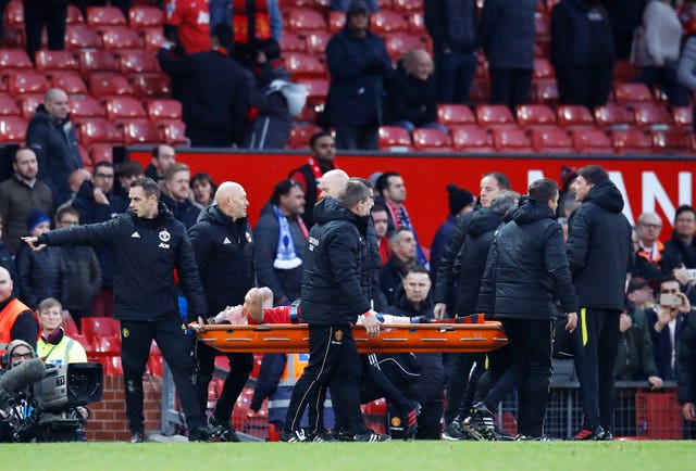 Scott McTominay is carried off the pitch