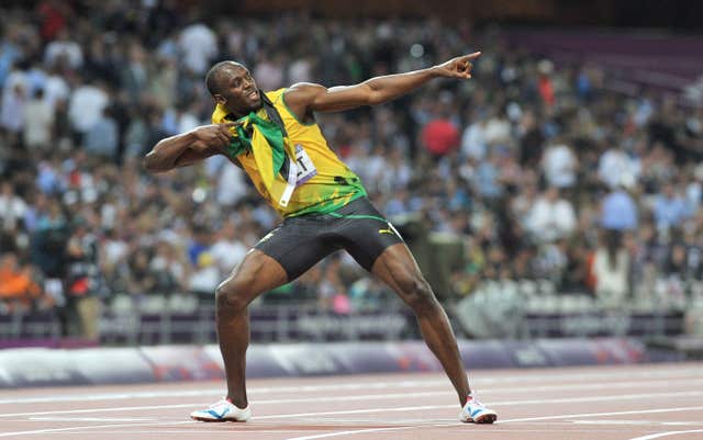 Usain Bolt does his trademark ‘Lightening Bolt’ after winning the 200m final 