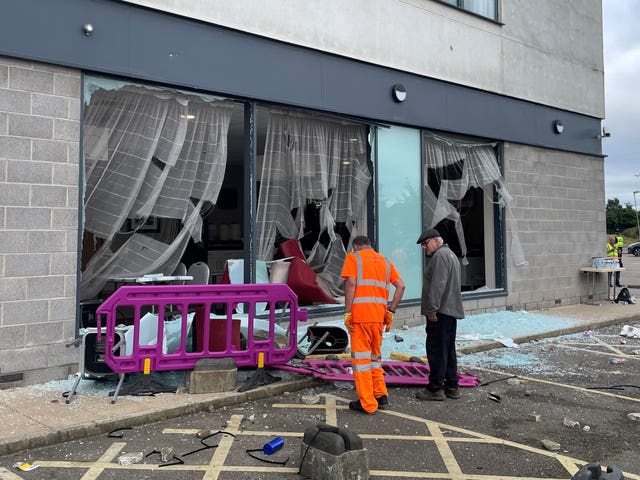 Damage at the Holiday Inn Express in Rotherham, South Yorkshire, where anti-immigration rioters smashed the windows before starting fires on Sunday.