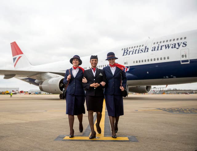 British Airways ambassadors welcome the special plane to London Heathrow (Steve Parsons/PA)