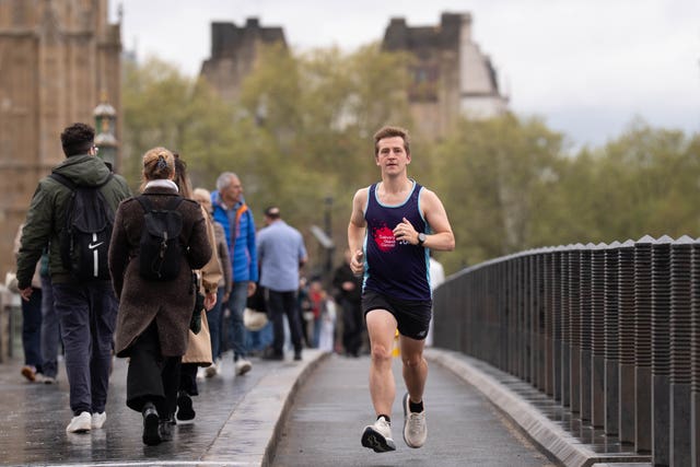 Josh Fenton-Glynn, Labour MP for Calder Valley, runs across Westminster Bridge in central London during training for the TCS London Marathon 2026