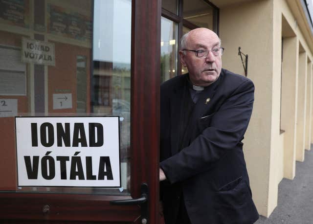 Father Tom Harrington arrives at the polling station at Knock National school, Mayo, as the country goes to the polls (Brian Lawless/PA)
