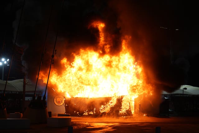 A fire breaks out at a merchandise kiosk outside the Etihad Stadium