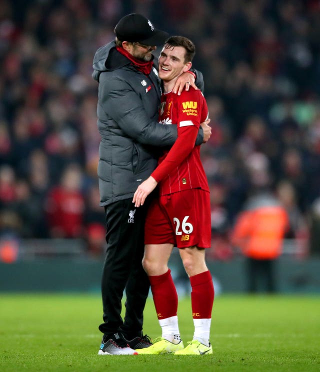 Liverpool manager Jurgen Klopp (left) hugs Andy Robertson