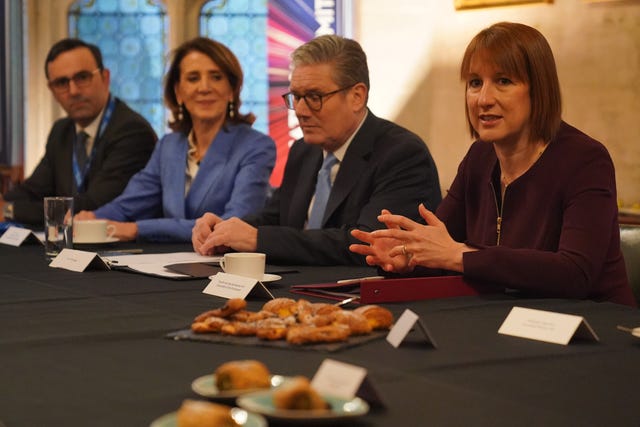 Rachel Reeves, sitting next to Sir Keir Starmer, speaks to business leaders during a breakfast roundtable at the Government's International Investment Summit