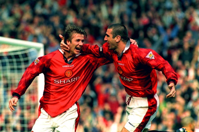 Manchester United’s Eric Cantona (right) and David Beckham celebrate after Beckham scores the winning goal
