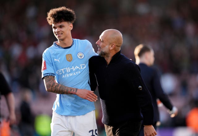 Nico O'Reilly is congratulated by Pep Guardiola after playing a key role in Manchester City's FA Cup win at Bournemouth
