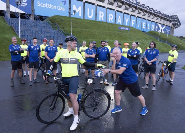 Kenny Logan, on bike, and Ally McCoist, right, as the team set off from Murrayfield 