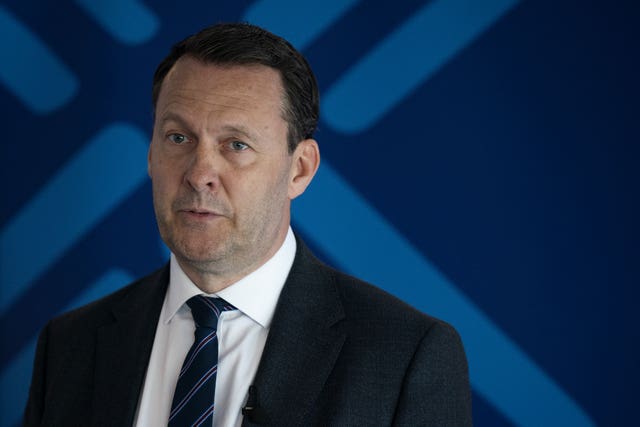 Russell Findlay, with Scottish Conservative signage in the background