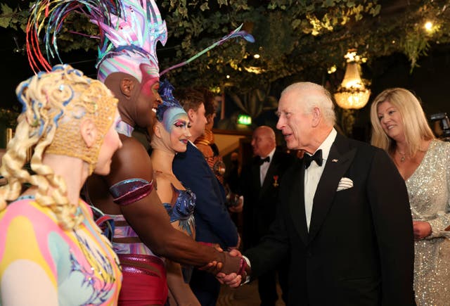 The King shakes hands with performers backstage after the Royal Variety Performance at the Royal Albert Hall last November