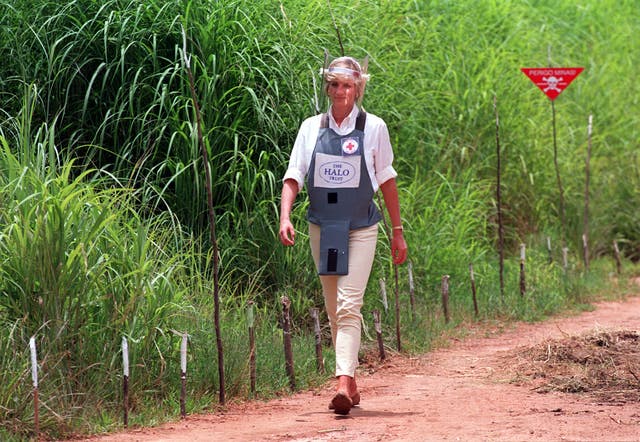 Diana, Princess of Wales walks through a recently cleared minefield in Angola