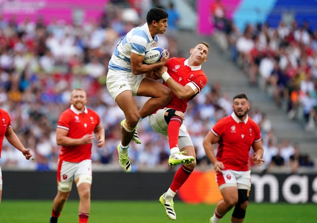 Argentina’s Lucio Cinti (left) and Wales’ Liam Williams battle for a high ball during the Rugby World Cup 2023 quarter final match at Stade de Marseille